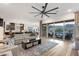 Open concept living room and kitchen with mountain views, sliding glass doors and wood floors at 21632 W Hillcrest Blvd, Buckeye, AZ 85396