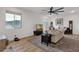 Living room featuring stylish decor, comfortable seating, and a large window with mountain views at 21632 W Hillcrest Blvd, Buckeye, AZ 85396
