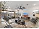 Spacious living room with natural light, desert views, a ceiling fan, and modern furnishings at 21632 W Hillcrest Blvd, Buckeye, AZ 85396