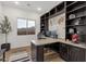 Office featuring a corner desk, custom built-ins and good natural light at 21632 W Hillcrest Blvd, Buckeye, AZ 85396