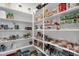 Well-organized walk-in pantry with multiple shelves, food and household supplies at 21632 W Hillcrest Blvd, Buckeye, AZ 85396