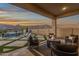 Outdoor patio area featuring comfortable seating and scenic mountain views, perfect for relaxation and entertainment at 21632 W Hillcrest Blvd, Buckeye, AZ 85396
