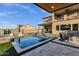 Inviting backyard pool, spa, and patio with outdoor seating create a relaxing oasis for entertaining and enjoying the outdoors at 21632 W Hillcrest Blvd, Buckeye, AZ 85396