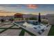 Inviting pool with built-in bar, fire pit, luxurious lounge chairs and spa, set against a breathtaking mountain backdrop at 21632 W Hillcrest Blvd, Buckeye, AZ 85396