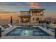 Resort-style backyard with a stunning pool, spa, and outdoor living space, perfect for relaxation at 21632 W Hillcrest Blvd, Buckeye, AZ 85396