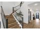 Modern staircase with wood steps, metal railings and high ceilings at 21632 W Hillcrest Blvd, Buckeye, AZ 85396