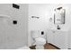 Modern bathroom featuring sleek fixtures, marble tile and a minimalist design at 2241 N Nicklaus Dr, Mesa, AZ 85215