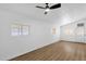 Bright bedroom features wood-look flooring and natural light from the windows at 2241 N Nicklaus Dr, Mesa, AZ 85215