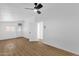 Bright bedroom with wood-look flooring and a modern ceiling fan at 2241 N Nicklaus Dr, Mesa, AZ 85215