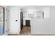 White kitchen with stainless steel appliances and neutral tile flooring at 2241 N Nicklaus Dr, Mesa, AZ 85215
