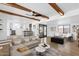 Open floor plan living room with beamed ceilings and updated decor at 2241 N Nicklaus Dr, Mesa, AZ 85215