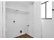 Small utility room featuring white walls, storage and closet space at 2241 N Nicklaus Dr, Mesa, AZ 85215