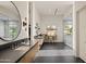 Luxurious bathroom features a double vanity, walk-in shower, and soaking tub at 23002 N Country Club Trl, Scottsdale, AZ 85255