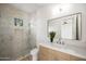 Elegant bathroom showcasing a glass shower and modern vanity with a large mirror, creating a spa-like ambiance at 23002 N Country Club Trl, Scottsdale, AZ 85255