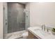 Contemporary bathroom features a walk-in shower with patterned tile and a modern vanity with white countertop at 23002 N Country Club Trl, Scottsdale, AZ 85255