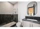 Modern bathroom featuring a tiled shower with a glass enclosure, sleek vanity, and contemporary finishes at 23002 N Country Club Trl, Scottsdale, AZ 85255