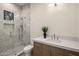 Stylish bathroom features marble tiling in shower, modern fixtures, and contemporary vanity at 23002 N Country Club Trl, Scottsdale, AZ 85255