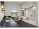 Bright bathroom featuring dual sinks, a modern bathtub, and a walk-in shower at 23002 N Country Club Trl, Scottsdale, AZ 85255