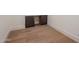 A section of a bedroom shows hardwood floors and baseboards at 23002 N Country Club Trl, Scottsdale, AZ 85255