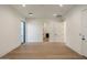 A spacious bedroom features hardwood floors, recessed lighting, and a connecting bathroom at 23002 N Country Club Trl, Scottsdale, AZ 85255