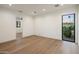 A bright bedroom features hardwood floors, recessed lighting, and an adjacent room at 23002 N Country Club Trl, Scottsdale, AZ 85255