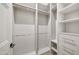 Well-organized closet with white shelving, multiple hanging rods and drawers at 23002 N Country Club Trl, Scottsdale, AZ 85255