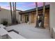 Private courtyard with custom landscaping and a covered patio, creating an inviting outdoor space at 23002 N Country Club Trl, Scottsdale, AZ 85255