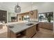 Bright and open kitchen featuring a large island, custom cabinetry, and a seamless flow to the outdoors at 23002 N Country Club Trl, Scottsdale, AZ 85255