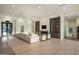 Spacious living room with a large comfortable sectional and a cozy fireplace at 23002 N Country Club Trl, Scottsdale, AZ 85255