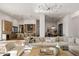 Bright and spacious living room seamlessly flows into the kitchen and dining area at 23002 N Country Club Trl, Scottsdale, AZ 85255