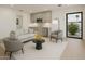 A light-filled living room offers a cozy seating arrangement and sleek kitchenette, perfect for relaxing and entertaining at 23002 N Country Club Trl, Scottsdale, AZ 85255