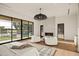 Comfortable main bedroom with a fireplace, seating area, and backyard view at 23002 N Country Club Trl, Scottsdale, AZ 85255