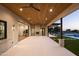 A covered patio with wood ceilings overlooks a backyard oasis, seamlessly blending indoor and outdoor spaces at 23002 N Country Club Trl, Scottsdale, AZ 85255