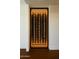 Wine storage provides ample room for storing and showcasing bottles, complete with sleek design and lighting at 23002 N Country Club Trl, Scottsdale, AZ 85255