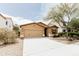 Charming single-story home featuring a two-car garage and desert landscaping at 25640 N 108Th Dr, Peoria, AZ 85383