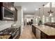Modern kitchen featuring a granite-topped island and stainless steel appliances at 26391 N 107Th Dr, Peoria, AZ 85383