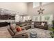 Bright living room with vaulted ceilings and an open concept to the kitchen at 26391 N 107Th Dr, Peoria, AZ 85383