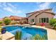 Backyard pool with lounge chairs and outdoor seating area; perfect for relaxing and entertaining at 26391 N 107Th Dr, Peoria, AZ 85383