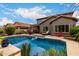 Beautiful backyard pool area with lounge chairs and lush greenery, ideal for relaxation and outdoor entertaining at 26391 N 107Th Dr, Peoria, AZ 85383