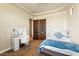Comfortable bedroom with a stylish vanity, bedside table, and natural light at 28025 N 156Th Pl, Scottsdale, AZ 85262