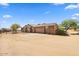 Single-story home with attached garage, large driveway, desert landscaping, and basketball hoop at 28025 N 156Th Pl, Scottsdale, AZ 85262