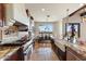 Bright eat-in kitchen with stainless steel appliances and granite countertops and a scenic view at 28025 N 156Th Pl, Scottsdale, AZ 85262
