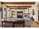 Bright living room with fireplace, exposed wood beams, and ample natural light at 28025 N 156Th Pl, Scottsdale, AZ 85262