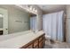 Bathroom featuring a vanity, large mirror, and shower with a curtain at 2929 E Broadway Rd # 30, Mesa, AZ 85204