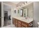 Bathroom featuring a vanity with double mirrors and views to the main bedroom at 2929 E Broadway Rd # 30, Mesa, AZ 85204
