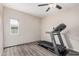 This bedroom has a modern ceiling fan and wood floors, and could be your home gym! at 2929 E Broadway Rd # 30, Mesa, AZ 85204