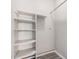 A white, empty closet with wooden floor and shelving at 2929 E Broadway Rd # 30, Mesa, AZ 85204