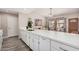 Bright kitchen featuring a large island with a sink and white cabinets open to living spaces at 2929 E Broadway Rd # 30, Mesa, AZ 85204