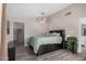 Bedroom featuring a ceiling fan, vinyl plank flooring, and neutral paint at 2929 E Broadway Rd # 30, Mesa, AZ 85204