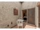 The cozy patio features a decorative wall hanging and stylish furniture for outdoor relaxation at 2929 E Broadway Rd # 30, Mesa, AZ 85204